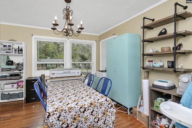 dining space with a notable chandelier, crown molding, and dark wood-type flooring