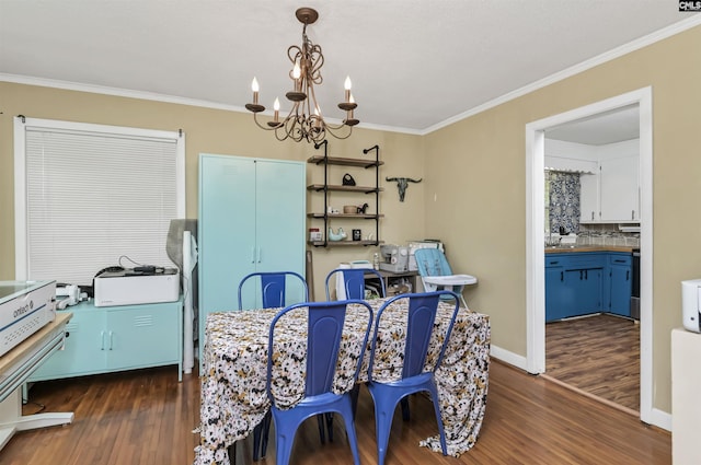 dining space featuring a chandelier, dark wood-type flooring, baseboards, and ornamental molding