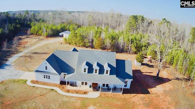 aerial view featuring a view of trees