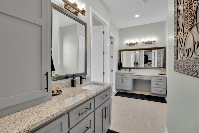 full bath with recessed lighting, visible vents, wood finished floors, and vanity