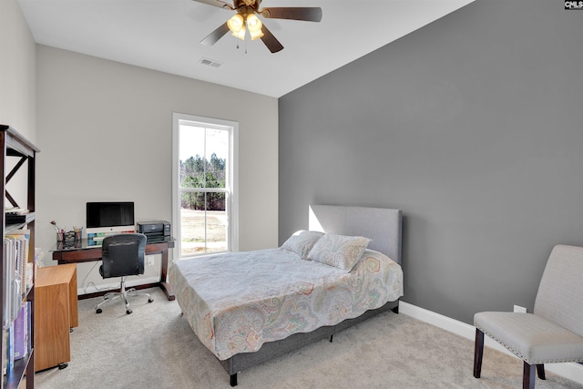 bedroom featuring a ceiling fan, baseboards, visible vents, and carpet floors