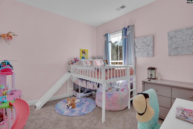 bedroom featuring visible vents, baseboards, and carpet floors