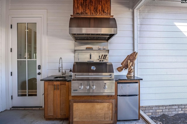 view of patio / terrace featuring a sink and a grill