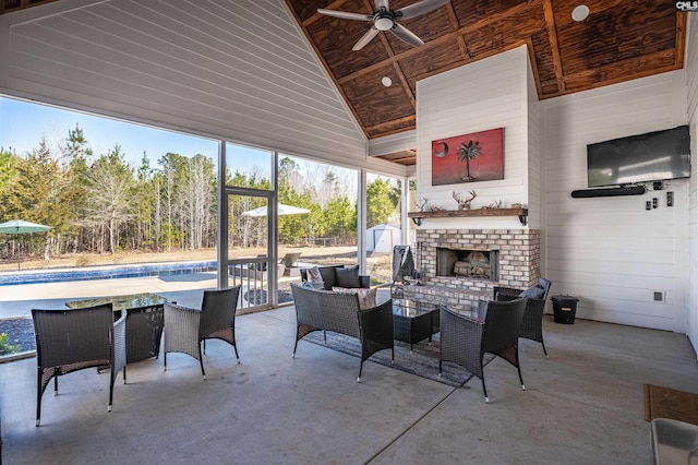 view of patio featuring ceiling fan, an outdoor pool, and an outdoor brick fireplace