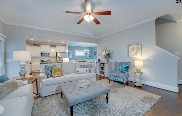 living room with ceiling fan with notable chandelier, crown molding, baseboards, and wood finished floors