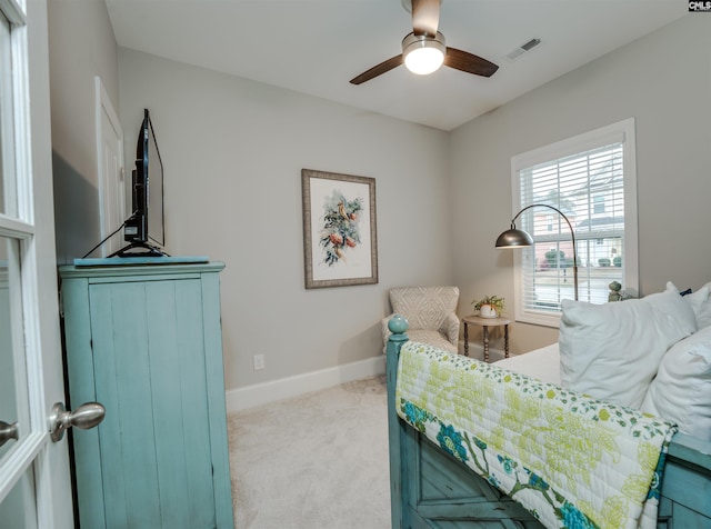 bedroom with visible vents, baseboards, carpet, and a ceiling fan