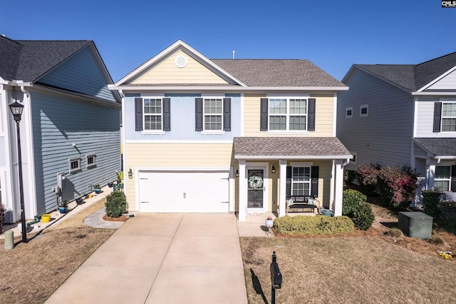 traditional home featuring covered porch, roof with shingles, concrete driveway, and an attached garage