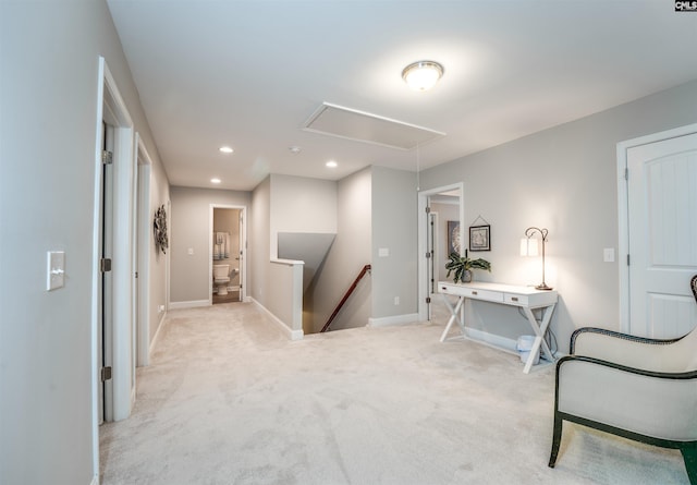 sitting room featuring baseboards, attic access, an upstairs landing, carpet flooring, and recessed lighting