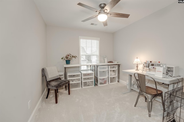 carpeted home office with visible vents, baseboards, and ceiling fan