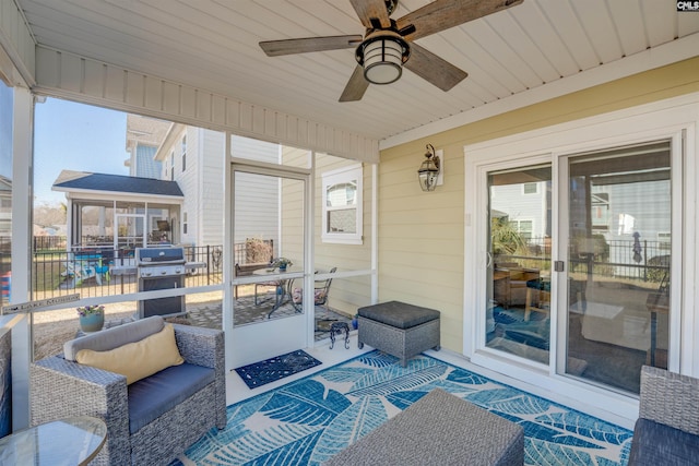 view of patio / terrace featuring area for grilling, a ceiling fan, and an outdoor hangout area