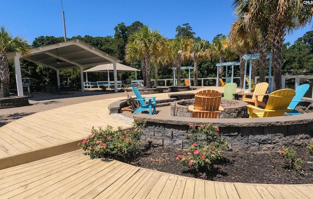 exterior space featuring a gazebo and a fire pit