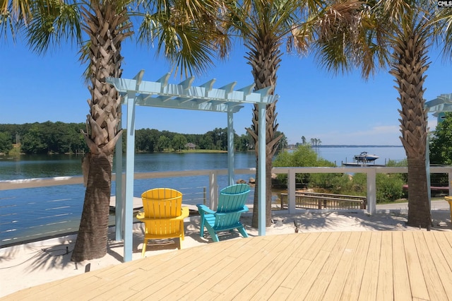 dock area with a pergola and a water view