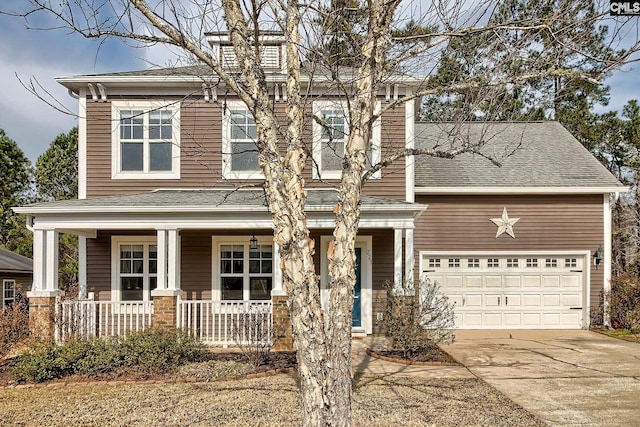 view of front of home featuring covered porch, driveway, and a shingled roof