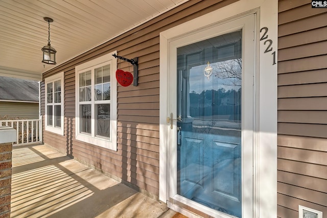 doorway to property with covered porch