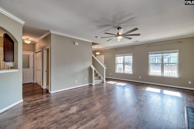 unfurnished living room featuring dark wood finished floors, stairway, baseboards, and ceiling fan