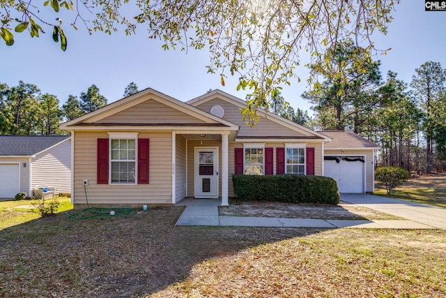 view of front facade with concrete driveway and a garage