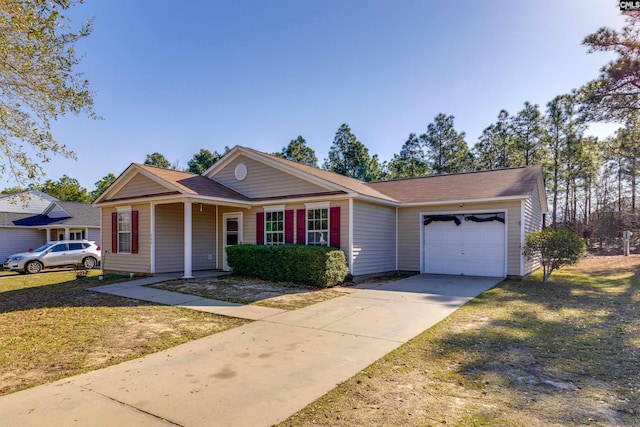 view of front of house with driveway, a front yard, and an attached garage