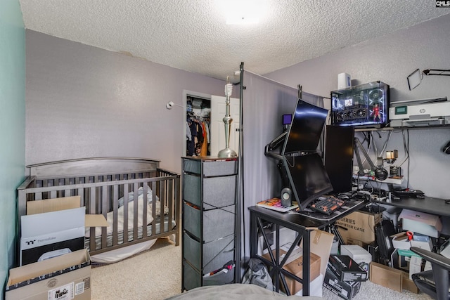 bedroom with a textured ceiling and carpet