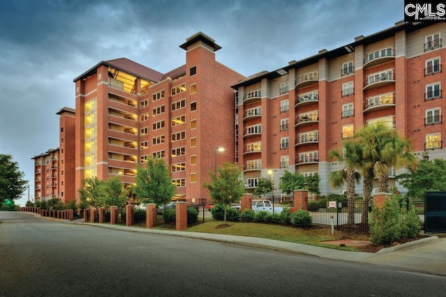 view of building exterior with fence