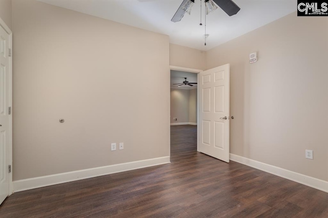 unfurnished bedroom featuring dark wood finished floors, a ceiling fan, and baseboards