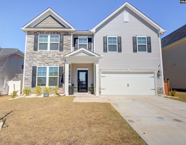 view of front of property with a front lawn, an attached garage, stone siding, and driveway