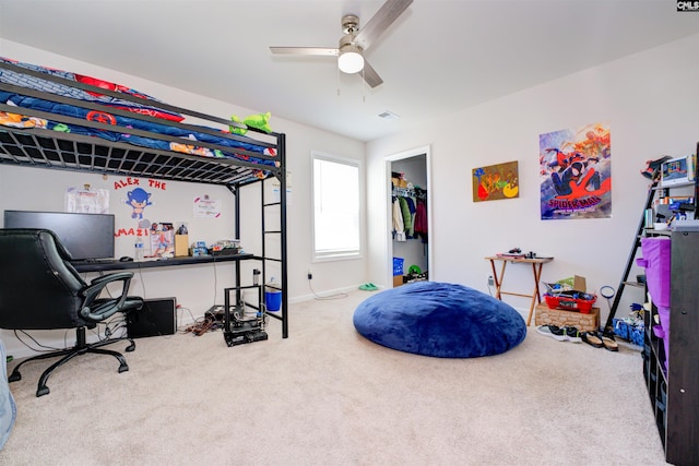 carpeted bedroom with visible vents and ceiling fan