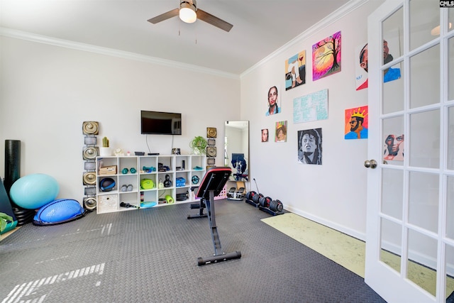 workout area with baseboards, crown molding, and a ceiling fan