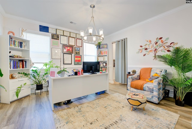 office area featuring crown molding, a notable chandelier, a healthy amount of sunlight, and visible vents