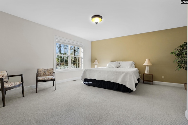 carpeted bedroom featuring baseboards