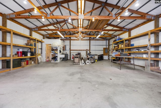 garage with metal wall and a workshop area