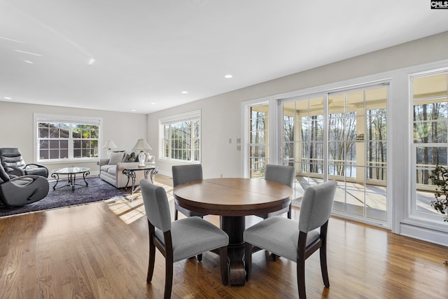 dining area with recessed lighting, wood finished floors, and a wealth of natural light