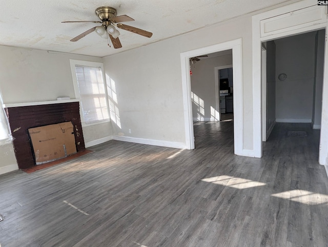 unfurnished living room featuring a textured ceiling, baseboards, a ceiling fan, and dark wood-style flooring