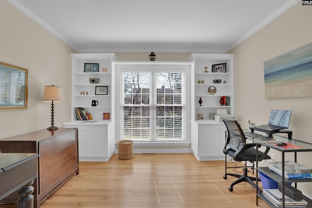 office area featuring light wood finished floors and crown molding