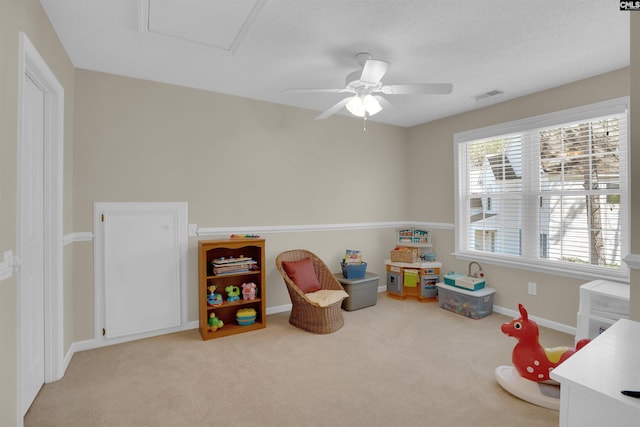 game room with visible vents, baseboards, ceiling fan, and carpet flooring