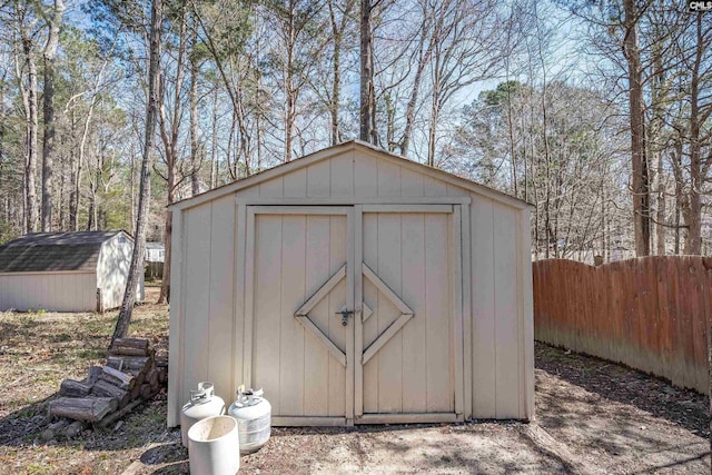 view of shed with fence