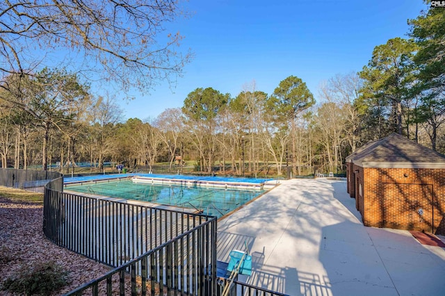 community pool featuring fence