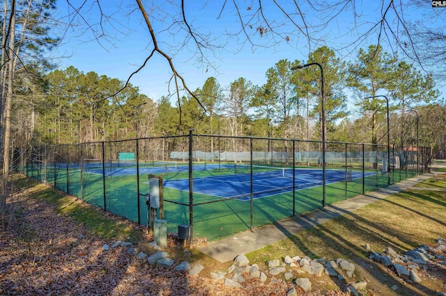 view of sport court with fence