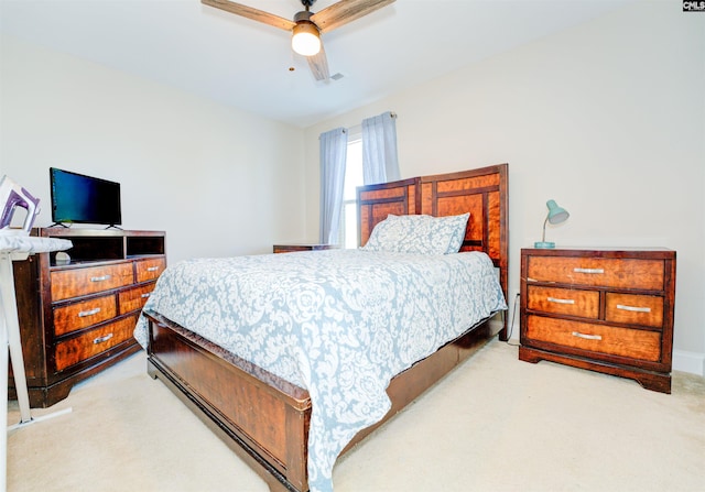 bedroom with light carpet and ceiling fan