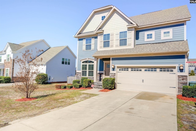 craftsman-style house with stone siding, driveway, a garage, and roof with shingles