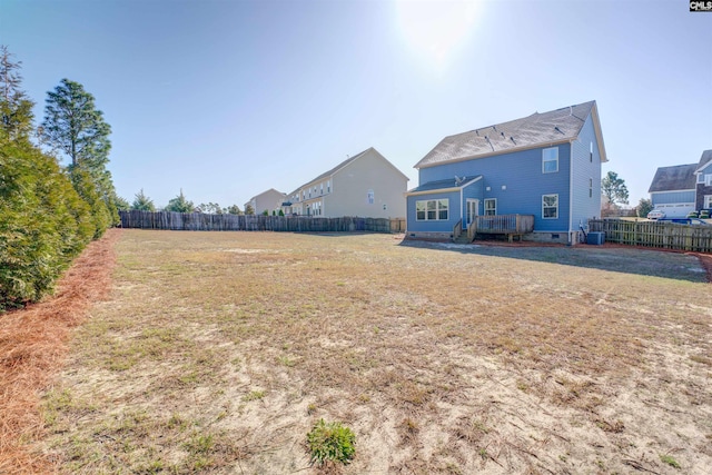 view of yard with cooling unit and a fenced backyard