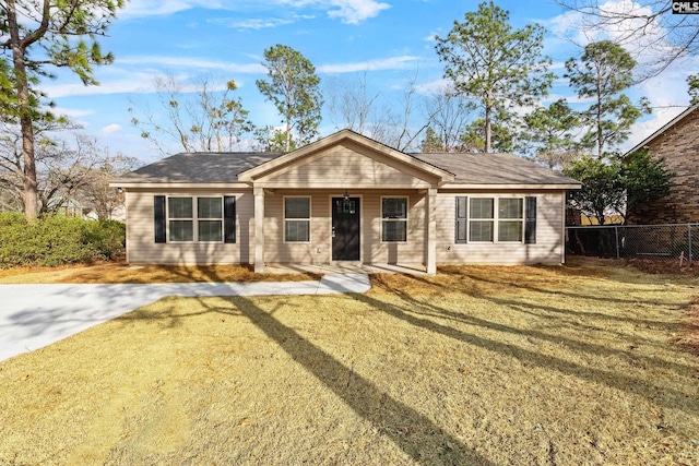 ranch-style house with a front lawn and fence