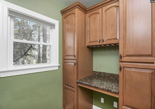 interior space with dark stone countertops