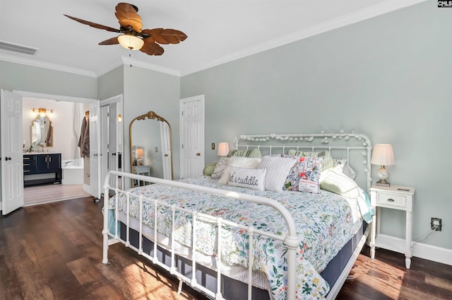 bedroom featuring visible vents, wood finished floors, baseboards, and ornamental molding