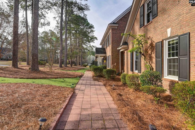 view of property exterior featuring brick siding