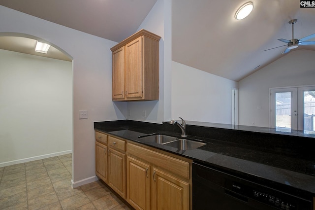 kitchen featuring a ceiling fan, a sink, dark stone countertops, black dishwasher, and arched walkways