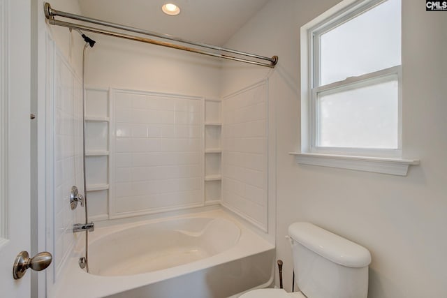 bathroom featuring toilet and shower / tub combination