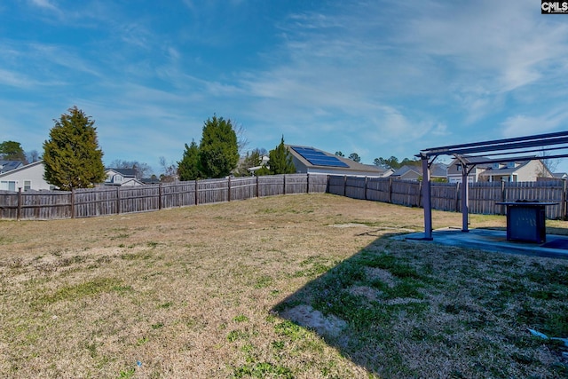 view of yard with a fenced backyard and a pergola