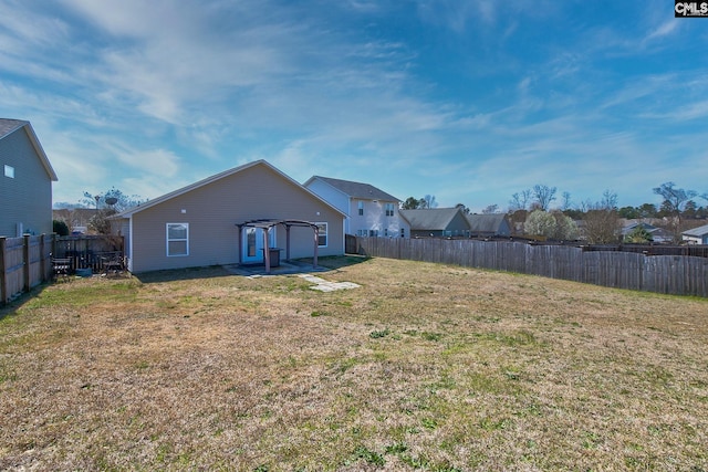 view of yard featuring a residential view and a fenced backyard