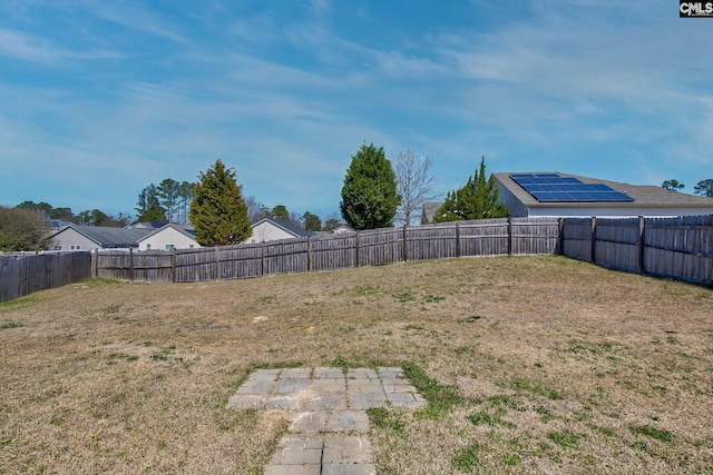 view of yard with a fenced backyard