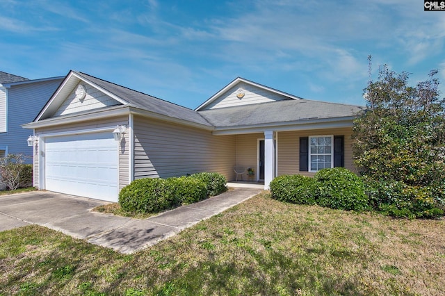 ranch-style home with a front lawn, concrete driveway, and an attached garage